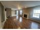 Spacious living room features a fireplace, ceiling fan, and hardwood-style floors at 2734 Mingo Ct, Indianapolis, IN 46217