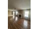 Spacious living room with hardwood-style floors, fireplace, and abundant natural light at 2734 Mingo Ct, Indianapolis, IN 46217
