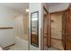 Bathroom featuring a tub-shower combo with curtain and access to the walk in closet at 306 Vinewood N Dr, Brownsburg, IN 46112