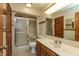 Bathroom featuring a vanity and tub-shower combo with glass sliding doors at 306 Vinewood N Dr, Brownsburg, IN 46112