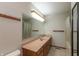 Bathroom with a large mirror over the vanity and a shower tub with curtain at 306 Vinewood N Dr, Brownsburg, IN 46112