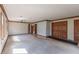 Large living room featuring carpet, wood flooring, and wood trim at 306 Vinewood N Dr, Brownsburg, IN 46112