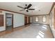 Spacious living room with wood and carpet flooring, light blue walls, and wood trim at 306 Vinewood N Dr, Brownsburg, IN 46112