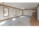 Bright and airy living room with large windows, carpet, and a ceiling fan for added comfort at 306 Vinewood N Dr, Brownsburg, IN 46112