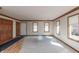 Sunny living room with wood trim, neutral walls, and multiple windows at 306 Vinewood N Dr, Brownsburg, IN 46112
