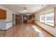Open-concept living area with updated flooring, lots of natural light and access to kitchen at 306 Vinewood N Dr, Brownsburg, IN 46112