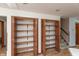 Double pantry with solid wood doors and multiple shelves for ample storage at 306 Vinewood N Dr, Brownsburg, IN 46112