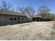 Beige building with gravel parking lot and partially fenced side yard at 3480 S Us Highway 31, Franklin, IN 46131