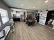 Open concept kitchen and dining area with dark cabinets and wood flooring at 3480 S Us Highway 31, Franklin, IN 46131