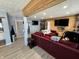 Modern living room with sectional sofa, large TV, and wood accent wall at 3480 S Us Highway 31, Franklin, IN 46131