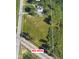 Aerial view of a large lot property with no HOA, surrounded by trees at 4305 Five Points Rd, Indianapolis, IN 46239