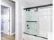 Bathroom with tub, shower, and updated fixtures at 4305 Five Points Rd, Indianapolis, IN 46239