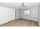 Bedroom with hardwood floors, ceiling fan, and double doors closet at 4305 Five Points Rd, Indianapolis, IN 46239