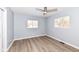 Bright bedroom with hardwood floors and ceiling fan at 4305 Five Points Rd, Indianapolis, IN 46239