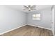 Bright bedroom with ceiling fan and light gray walls at 4305 Five Points Rd, Indianapolis, IN 46239