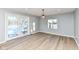 Bright dining area with hardwood floors and sliding glass doors leading to the backyard at 4305 Five Points Rd, Indianapolis, IN 46239