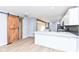 Dining area features hardwood floors, barn door, and kitchen views at 4305 Five Points Rd, Indianapolis, IN 46239