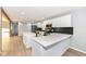 Open concept kitchen boasts white cabinets, quartz countertops, and an island at 4305 Five Points Rd, Indianapolis, IN 46239