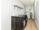 Laundry room with washer, dryer, and shelving at 4305 Five Points Rd, Indianapolis, IN 46239
