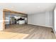 Open concept living room and kitchen with a modern island and gray walls at 4305 Five Points Rd, Indianapolis, IN 46239