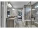 Elegant bathroom with double vanity, large shower, and view of bedroom at 4398 Chital Pl, Greenwood, IN 46143