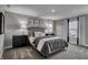 Cozy bedroom with gray upholstered bed and modern nightstands at 4398 Chital Pl, Greenwood, IN 46143