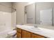 Bathroom features a shower/tub, toilet, and wood vanity at 450 E Ohio St # 106, Indianapolis, IN 46204