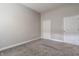 Spacious bedroom with neutral walls, carpet, and two doors at 450 E Ohio St # 106, Indianapolis, IN 46204