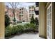 View of a lovely courtyard with landscaping and seating at 450 E Ohio St # 106, Indianapolis, IN 46204