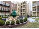 Community courtyard with seating, fountain, and grill at 450 E Ohio St # 106, Indianapolis, IN 46204
