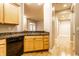Kitchen with granite countertops and wooden cabinets at 450 E Ohio St # 106, Indianapolis, IN 46204