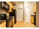 Kitchen with granite countertops and black appliances at 450 E Ohio St # 106, Indianapolis, IN 46204