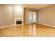 Spacious living room with hardwood floors and fireplace at 450 E Ohio St # 106, Indianapolis, IN 46204