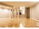 Open living area with hardwood floors and kitchen access at 450 E Ohio St # 106, Indianapolis, IN 46204