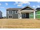 Exterior view of home with a covered patio and an expansive, unfinished yard at 5511 Sienna Ct, Brownsburg, IN 46112