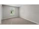Bedroom featuring plush carpeting and neutral decor with natural light at 5511 Sienna Ct, Brownsburg, IN 46112