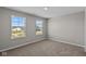 Bright bedroom featuring plush carpeting and natural light from large windows at 5511 Sienna Ct, Brownsburg, IN 46112