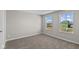 Bright bedroom featuring plush carpeting and natural light from large window at 5511 Sienna Ct, Brownsburg, IN 46112