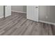 Bedroom interior showing neutral walls and light-colored wood-look flooring at 5511 Sienna Ct, Brownsburg, IN 46112