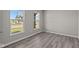 Bedroom featuring natural light from large windows and light-colored wood-look flooring at 5511 Sienna Ct, Brownsburg, IN 46112