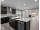 Modern kitchen with stainless steel appliances, an island and an open view to the living room at 5511 Sienna Ct, Brownsburg, IN 46112