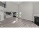 Spacious open-concept living room with a fireplace, lots of natural light and seamless flow to the kitchen at 5511 Sienna Ct, Brownsburg, IN 46112