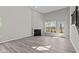 A bright open-concept living area features a fireplace and natural light from the windows at 5511 Sienna Ct, Brownsburg, IN 46112