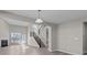 Bright living room featuring a fireplace, lots of natural light and staircase access to upper level at 5511 Sienna Ct, Brownsburg, IN 46112