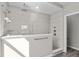 Tiled shower features dual shower heads, glass enclosure, and heated towel bar at 5511 Sienna Ct, Brownsburg, IN 46112