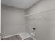 Unfinished storage room with wire shelving and hookups for laundry appliances at 5511 Sienna Ct, Brownsburg, IN 46112