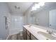 Main bathroom with double vanity, tub, and shower at 6250 Bales Dr, Plainfield, IN 46168