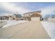 Two-story brick home with attached garage and snowy front yard at 6250 Bales Dr, Plainfield, IN 46168