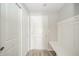Mudroom with bench, hooks, and double closet at 6250 Bales Dr, Plainfield, IN 46168