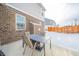 Cozy patio with seating area, brick wall, and fenced yard at 6250 Bales Dr, Plainfield, IN 46168